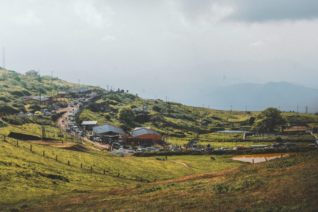 Peaceful countryside scene with hills, trees, and road in Chikkamagaluru, India.
