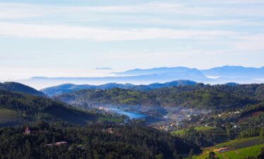A breathtaking aerial capture of Ooty's lush green hills and serene landscape.