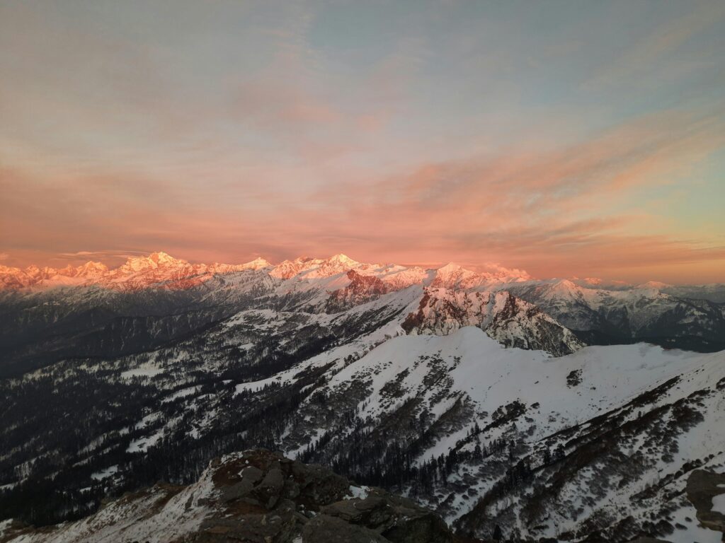 Breathtaking twilight view of snow-capped mountains in Sankari, India showcasing nature's beauty.