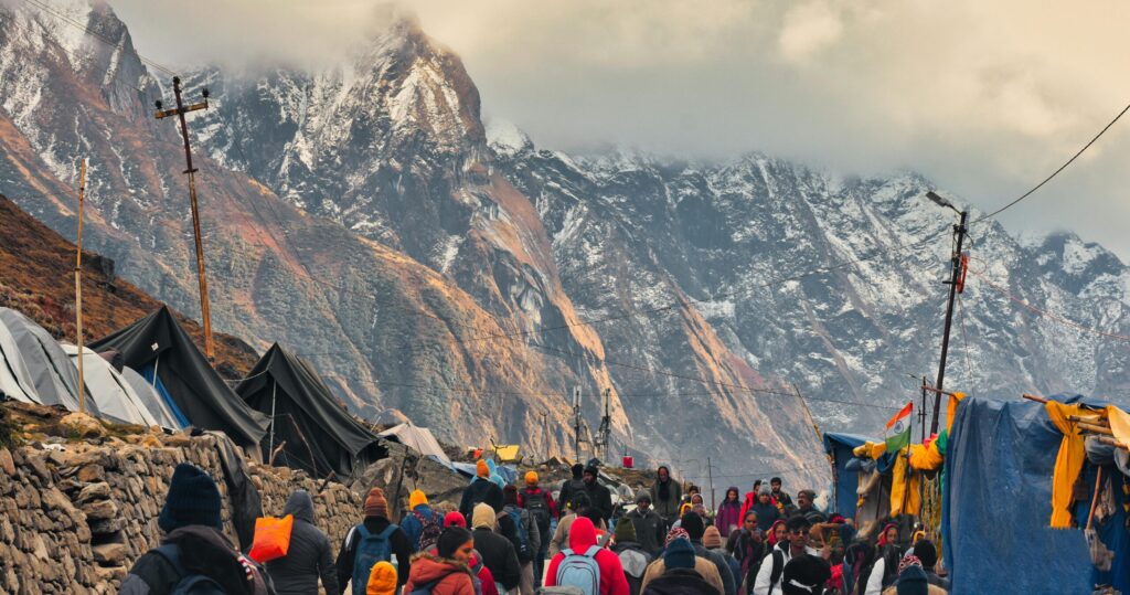Explore the lively streets of Kedarnath with stunning Himalayan backdrop, capturing the essence of local life.