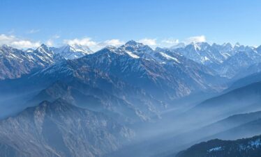 Stunning view of the Himalayan mountains in Uttarkashi, India on a clear day.