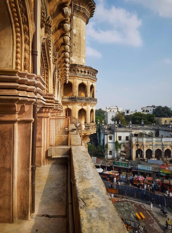 Explore the intricate architecture of Charminar in Hyderabad's bustling old town.